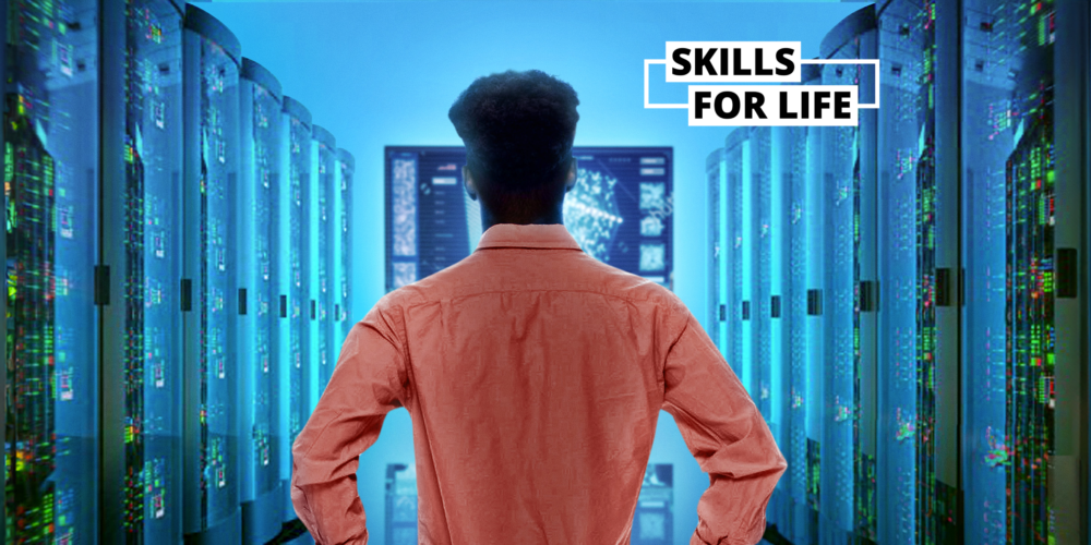 Shot from behind of a person looking confidently into an electric blue room filled with powerful supercomputers
